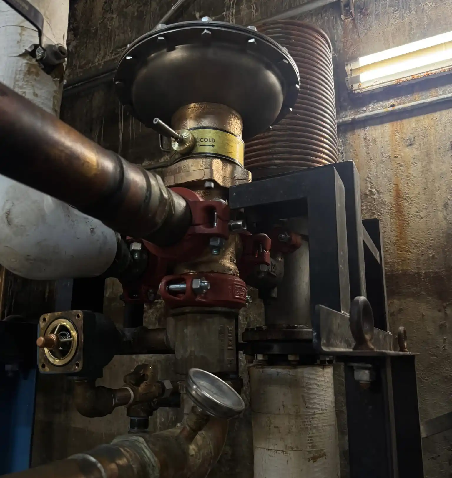 Commercial Pressure Regulating Valve Commercial pressure regulating valve installed in a building mechanical room